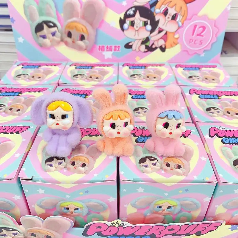 Scatola cieca di figurine in peluche di 12 pezzi con un bambino che piange, con alto valore estetico.